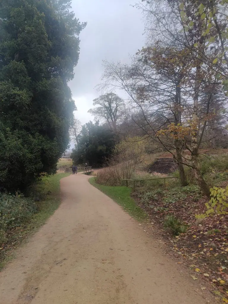 Pathway through the trees, with the cascade on the right hand side.